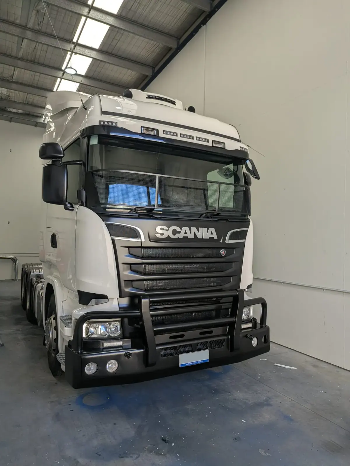 White prime mover inside the workshop after painting